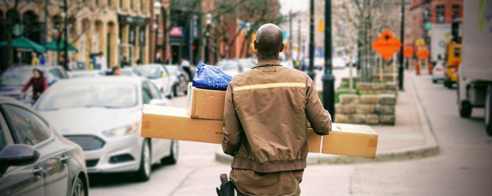 A delivery driver delivering parcels