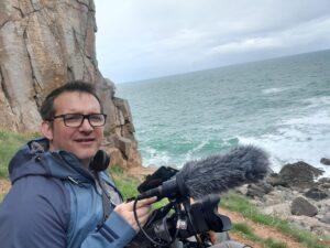 Matt Everett founder of Dragonfly Films near a coast